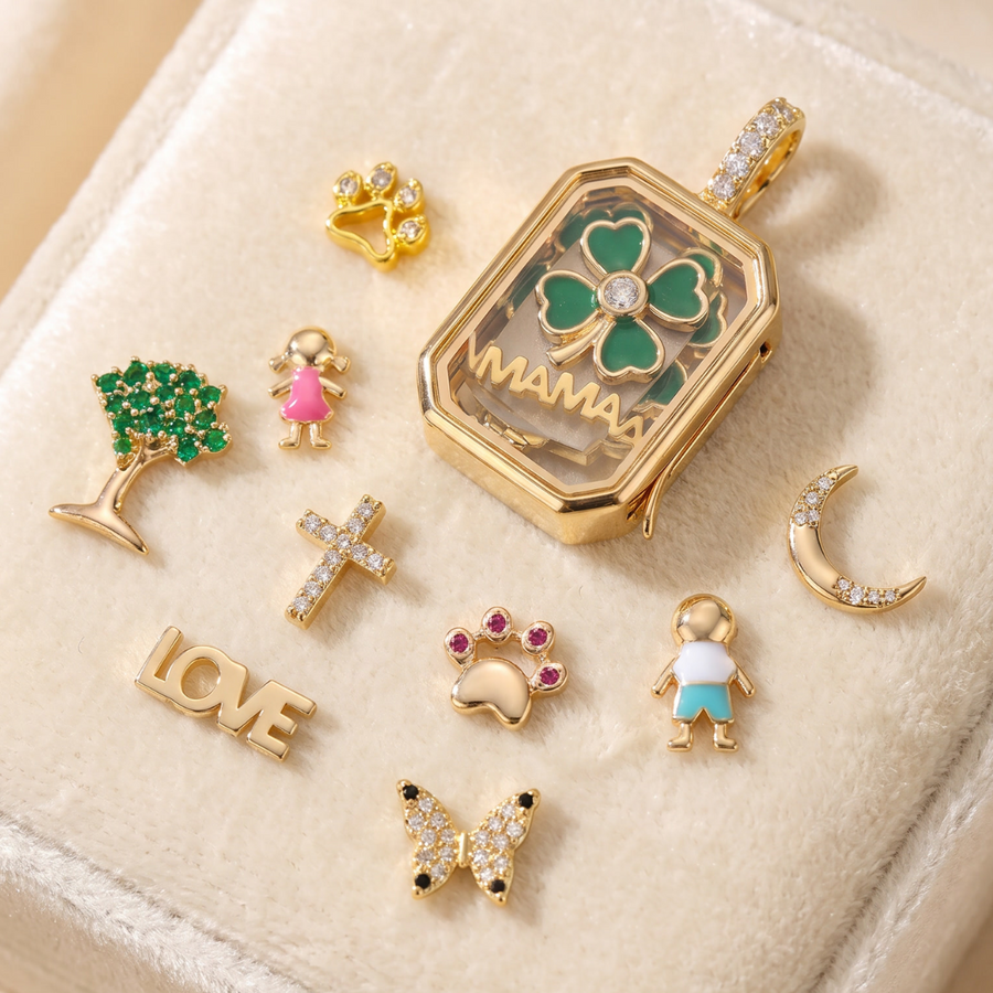Open locket containing charms and a tiny lock of hair
